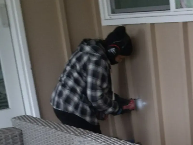 Professional electrician installing an exterior outlet in Searcy
