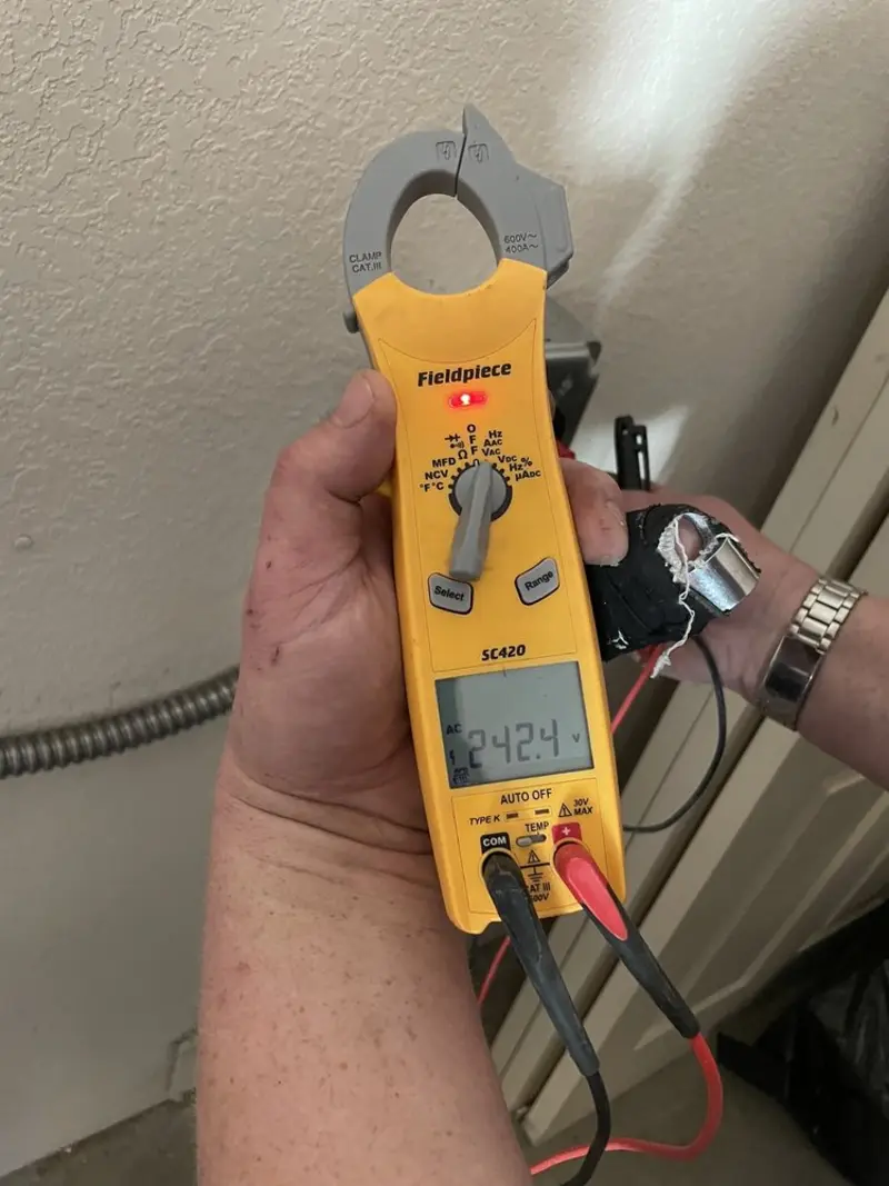 Voltage testing with clamp meter during Ceiling Fan Installation in Searcy